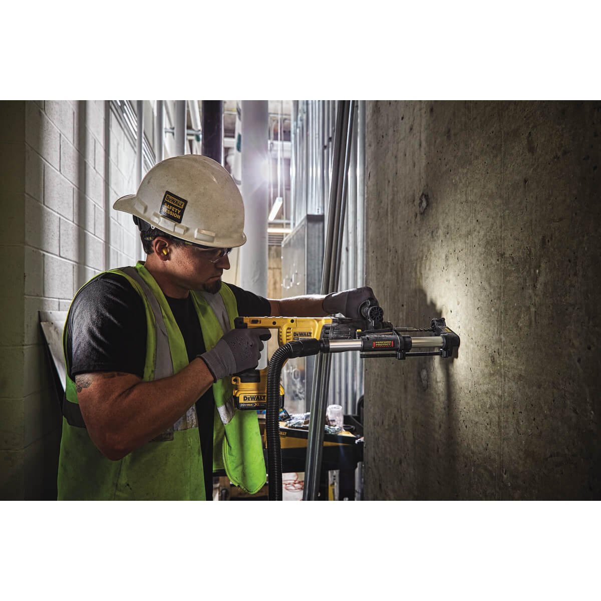 Worker drilling concrete with a DEWALT SDS-plus rotary hammer