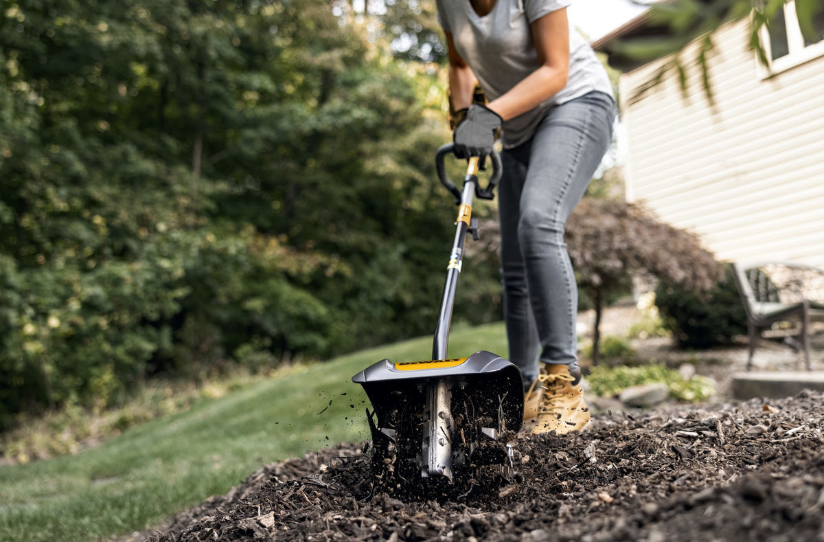 DEWALT DWOAS3CL Cultivator Attachment - in use