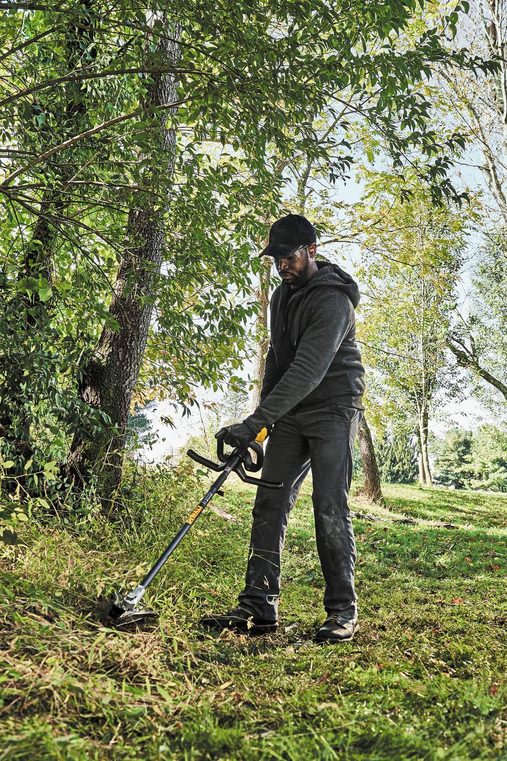 DEWALT DWOAS5BC Brush Cutter Attachment - in use