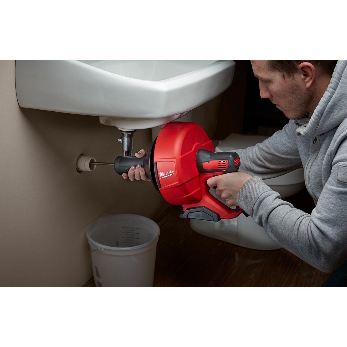 Milwaukee 2571-21 M12™ Drain Snake Kit - in use