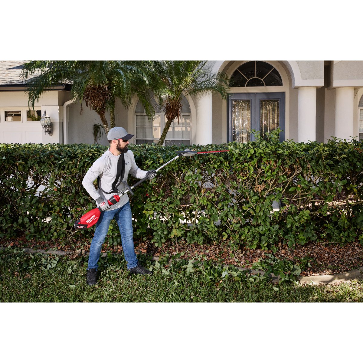 Milwaukee 3012-20 M18 FUEL™ Pole Articulating Hedge Trimmer - in use