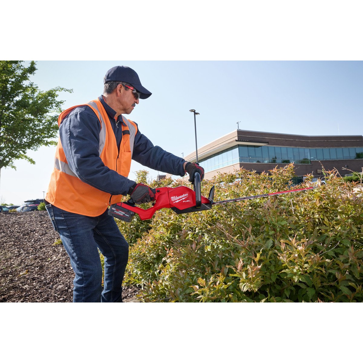 Milwaukee 3034-21 M18 FUEL™ 30" Hedge Trimmer Kit - in use