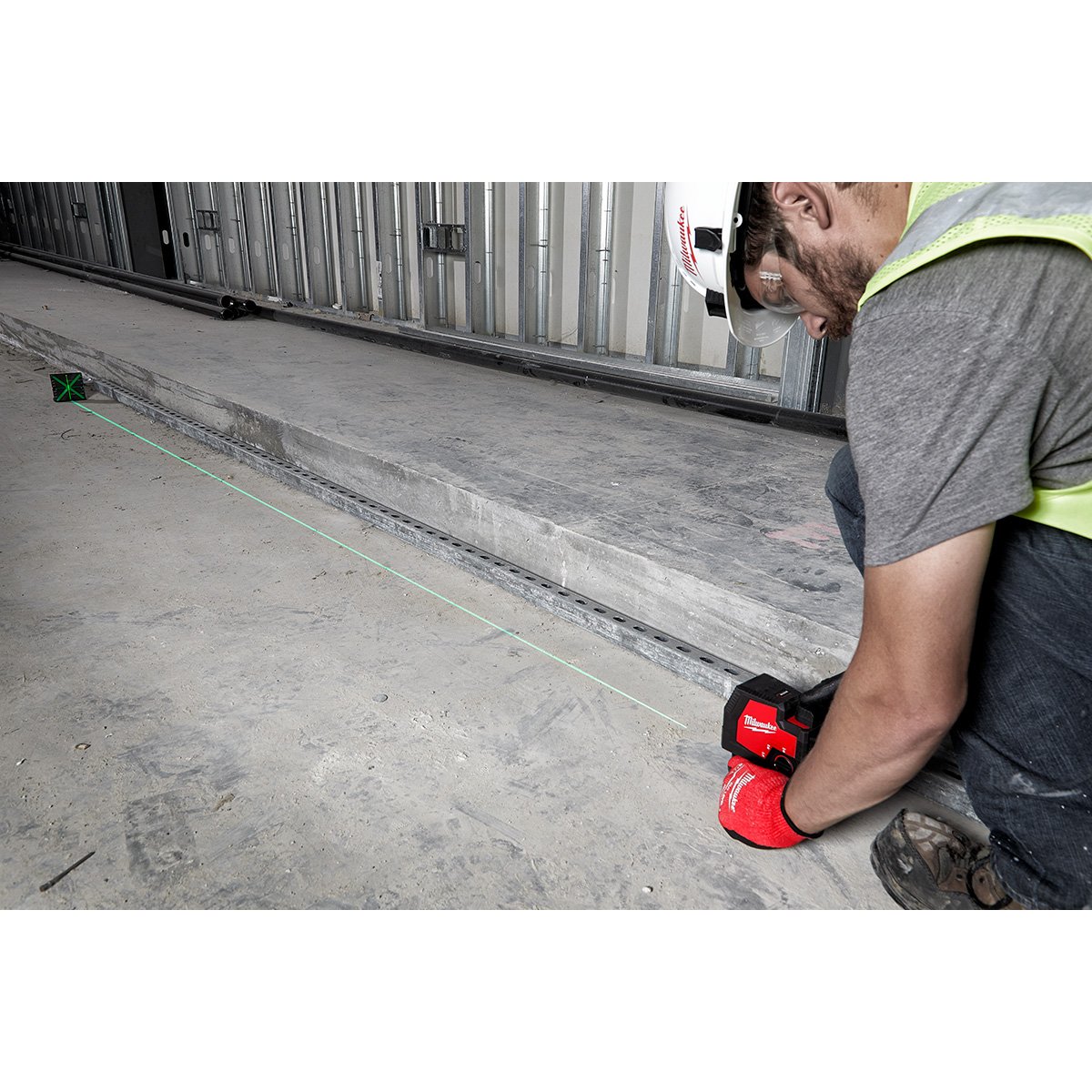 Milwaukee 3521-21 USB Rechargeable Green Cross Line Laser - in use