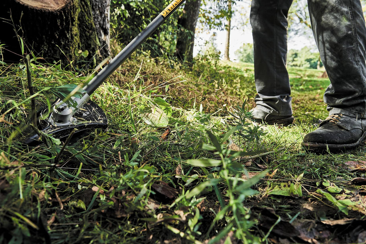 DEWALT DWOAS5BC Brush Cutter Attachment - in use