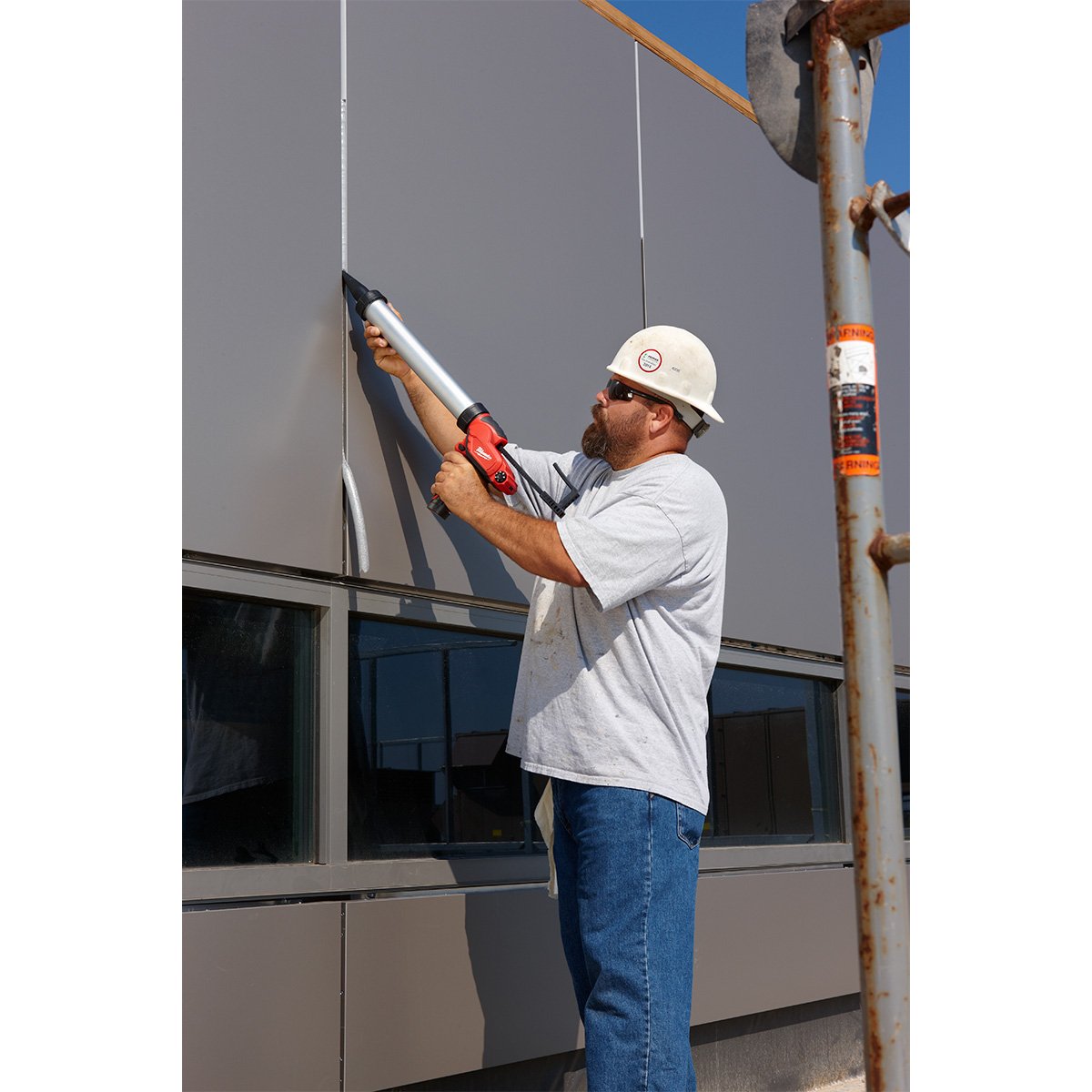 Milwaukee 2442-21 M12™ Sausage Caulk Gun Kit - in use