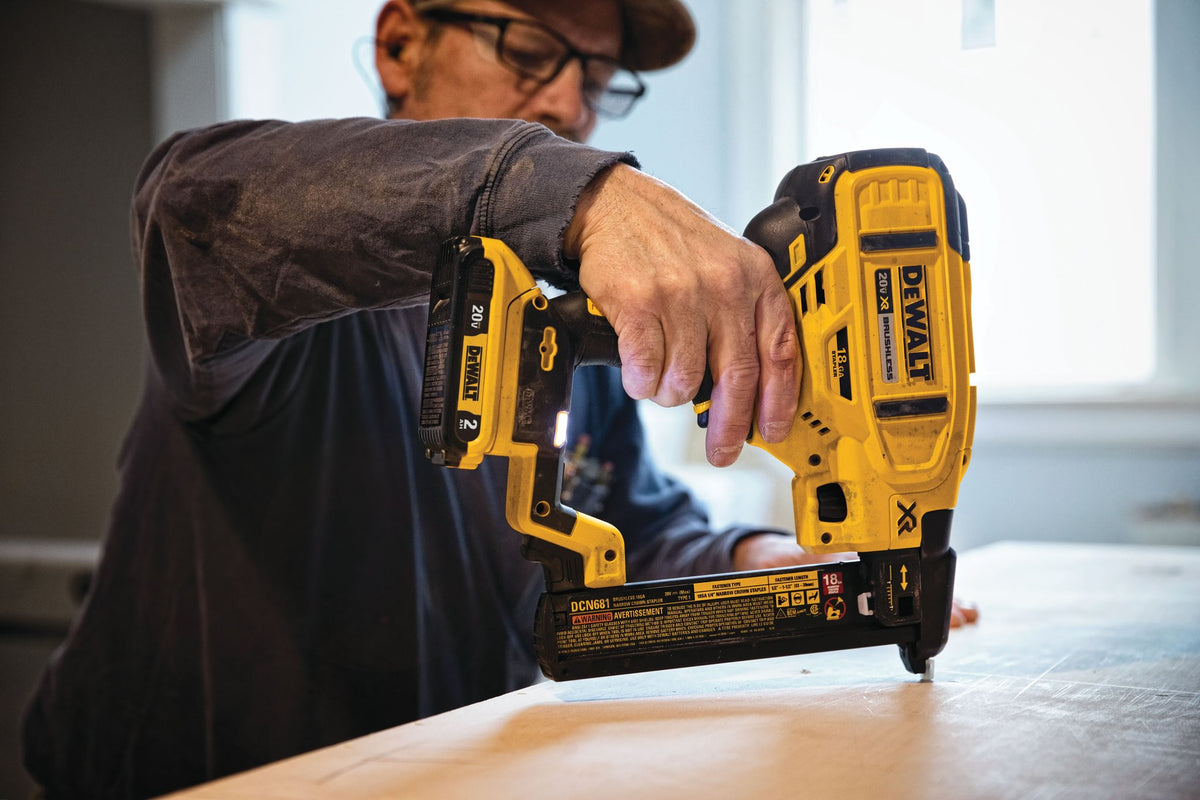 DEWALT DCN681B 20V MAX* XR® 18 GA Cordless Narrow Crown Stapler (Tool Only) - in use