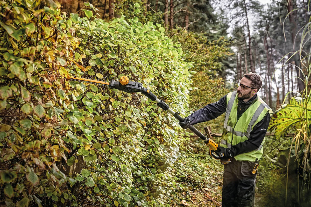 DEWALT DCPH820B 20V MAX Pole Hedge Trimmer - in use