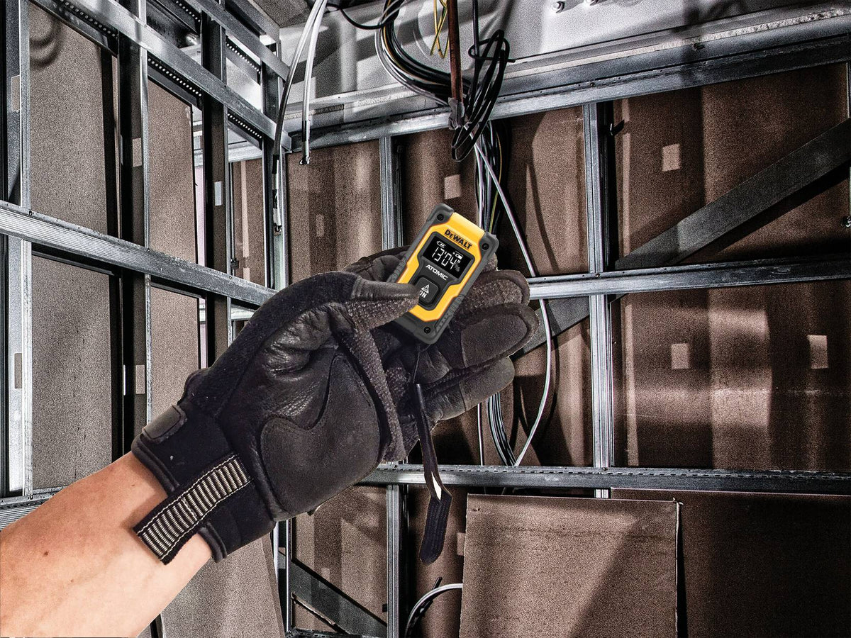 DEWALT DW055PL ATOMIC COMPACT SERIES™ 55 FT. POCKET LASER DISTANCE MEASURER - in use