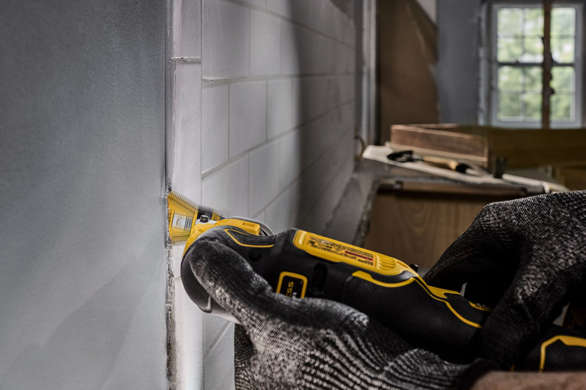 DEWALT DWA4283B Oscillating 2 1/8In 3-Sided Bimetal 10 Piece - in use