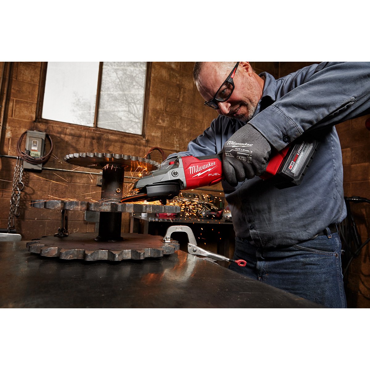Milwaukee 2886-20 M18 FUEL™ 5" Flathead Braking Grinder, Paddle Switch No-Lock - in use