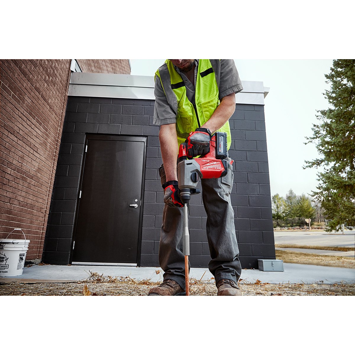 Milwaukee 2912-22 M18 FUEL™ 1 in SDS Plus Rotary Hammer Kit - in use
