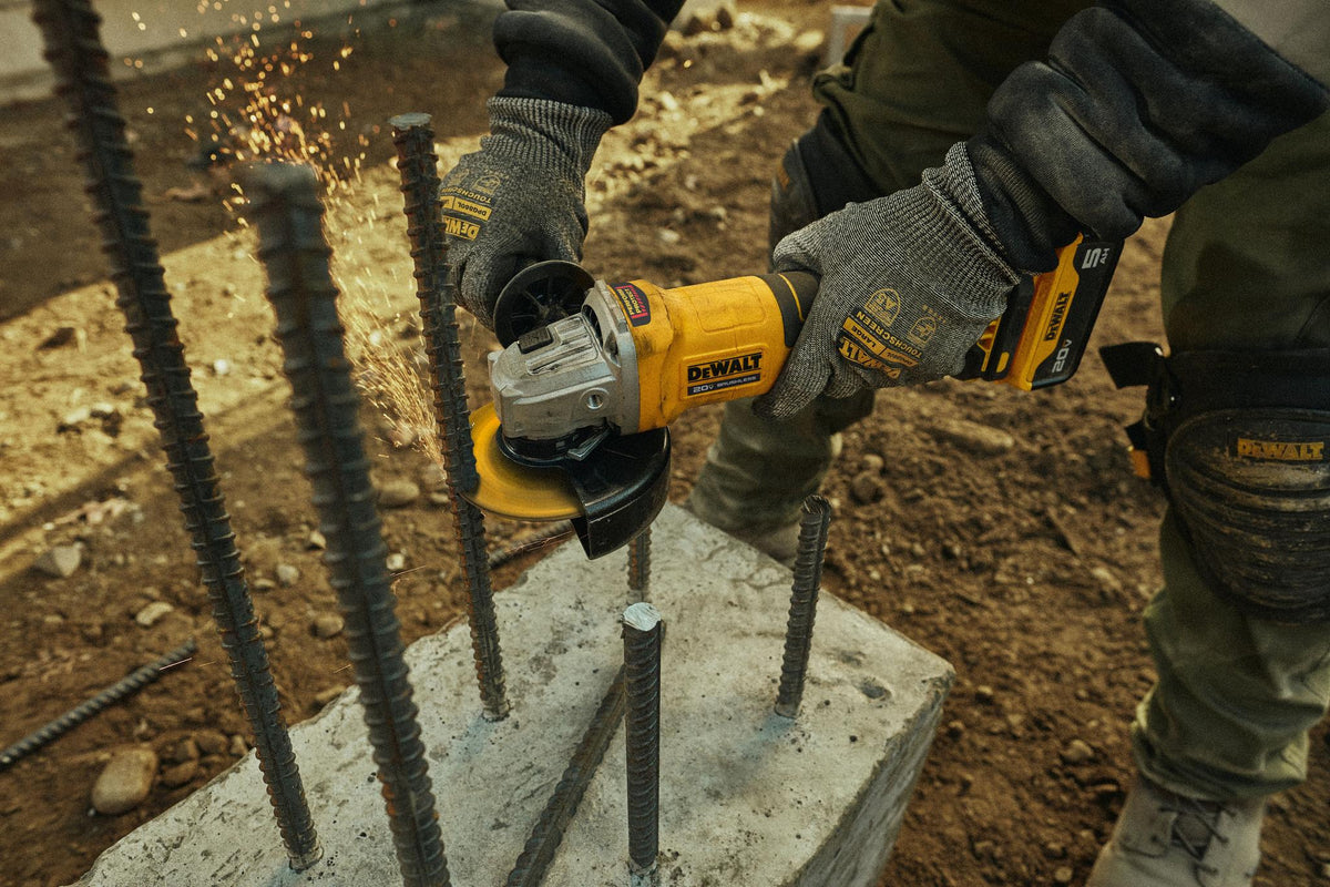 DEWALT DCG408B 20V MAX 4-1/2 in. Brushless Paddle-Switch Grinder (Tool Only) - in use