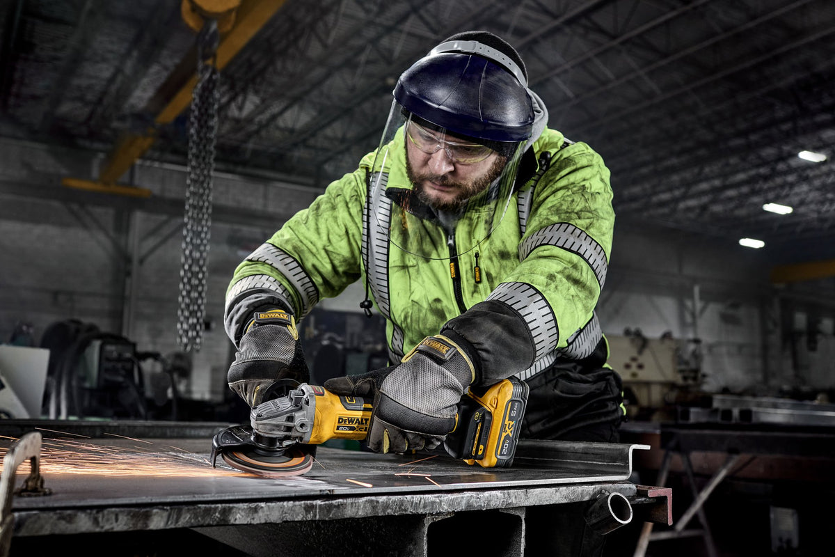 DEWALT DCG410VSB 20V MAX* XR® BRUSHLESS CORDLESS 4-1/2 IN. - 5 IN. VARIABLE SPEED PADDLE SWITCH GRINDER (TO - in use