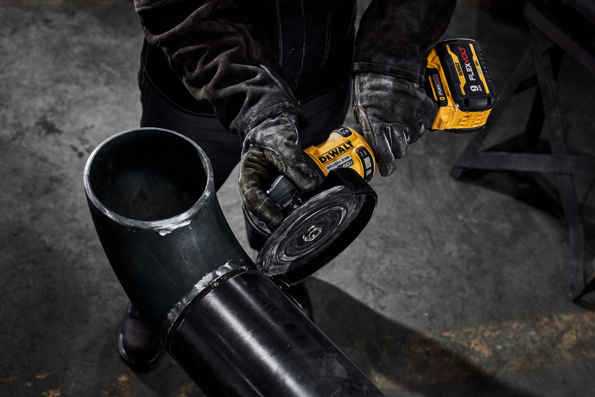 DEWALT DCG440B 60V Max 7 In. Brushless Cordless Grinder With Kickback Brake (Tool Only) - in use