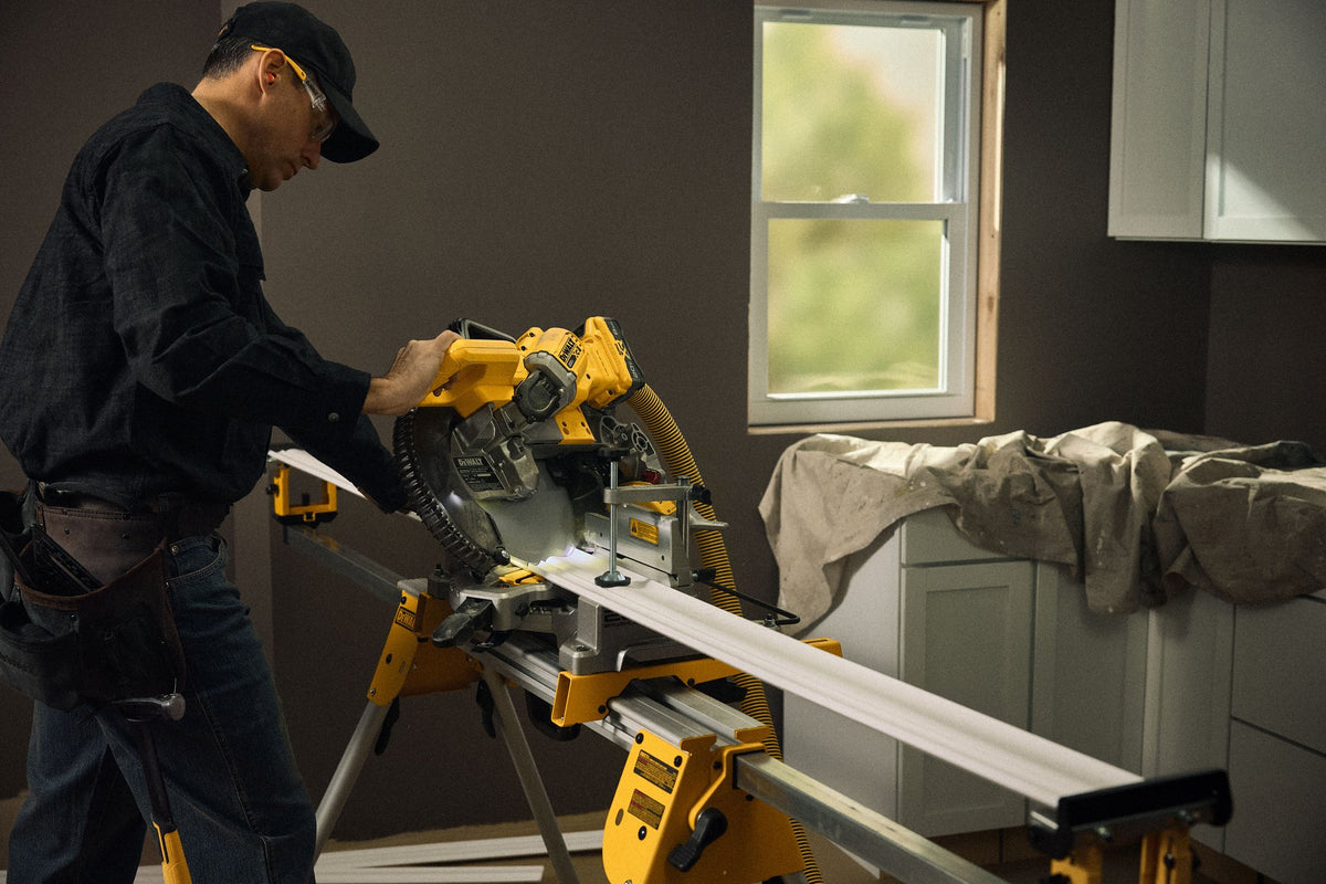 DEWALT DCS714B 20V MAX* XR® 10 in. Double Bevel Fixed Miter Saw (Tool Only) - in use