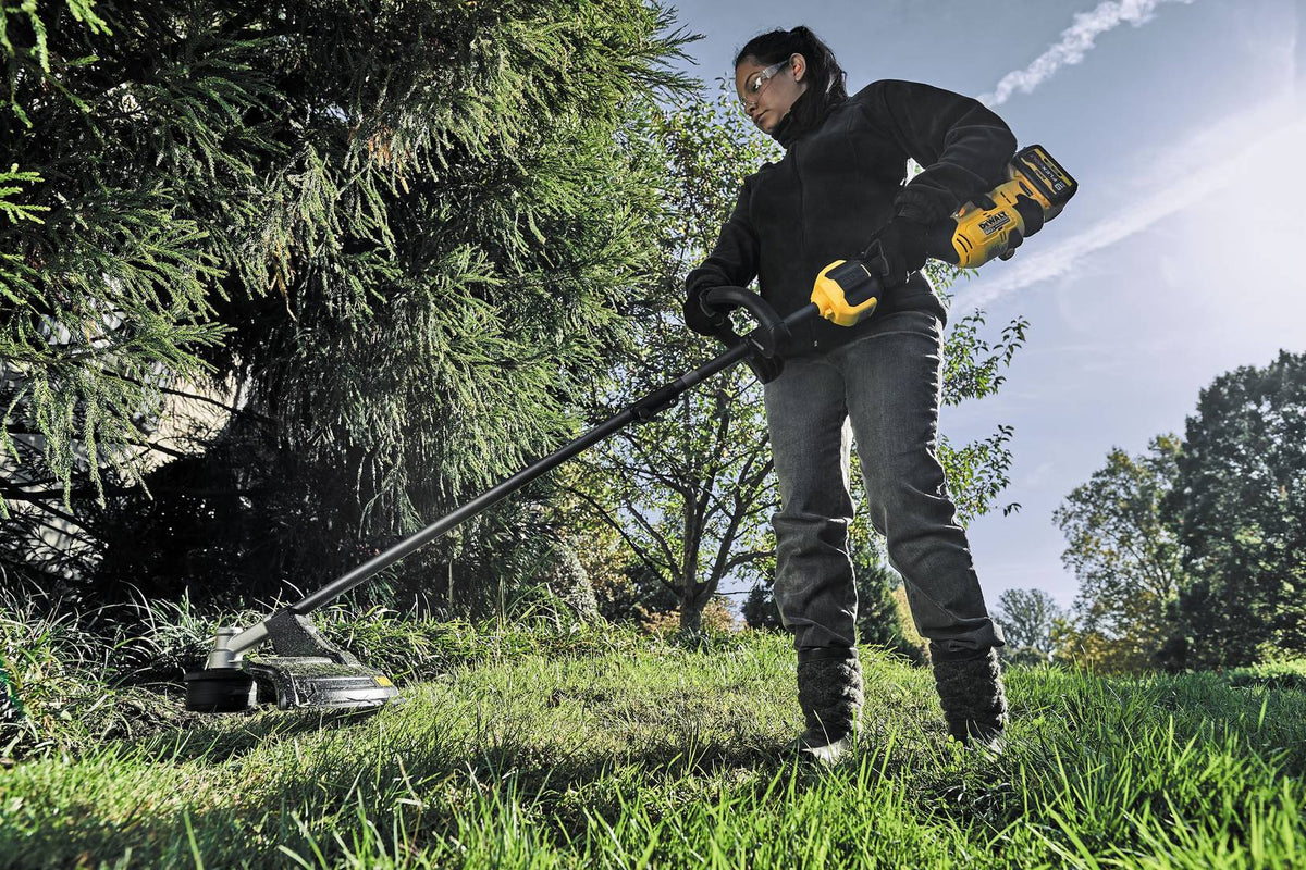 DEWALT DCST972B 60V MAX 17 in. Brushless Attachment Capable String Trimmer (Tool Only) - in use