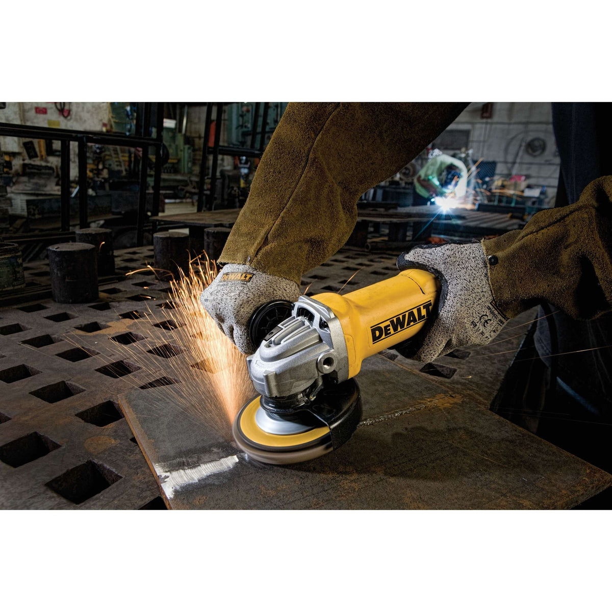 DEWALT DWE402 Angle Grinder Tool, Paddle Switch, 4-1/2-Inch, 11-Amp - in use