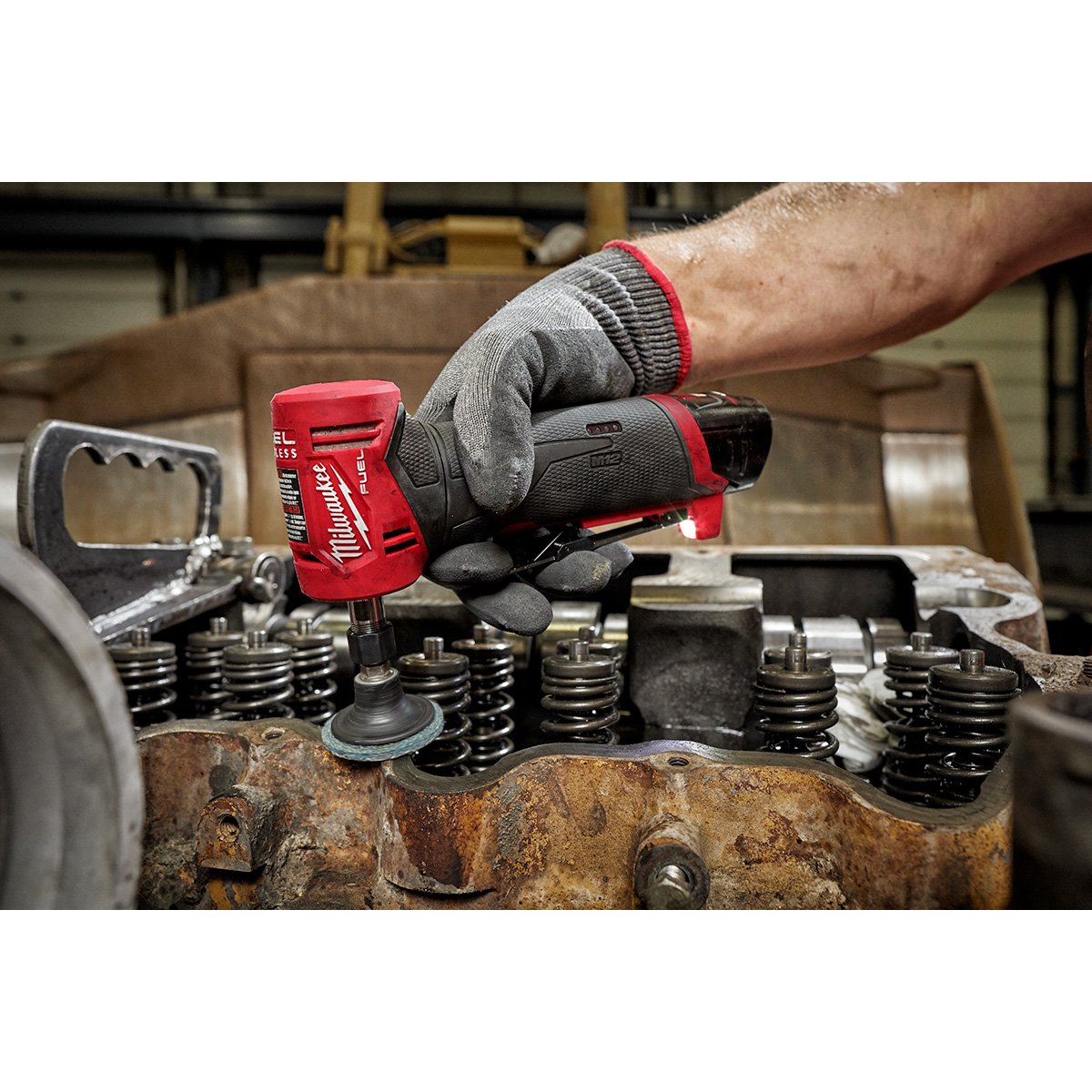Milwaukee 2485-22 M12 FUEL™ 1/4" Right Angle Die Grinder Kit - in use