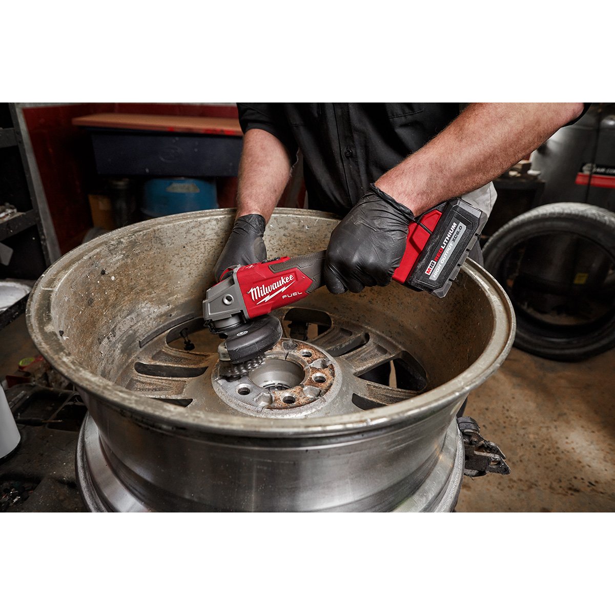 Milwaukee 2889-20 M18 FUEL™ 4-1/2" / 5" Variable Speed Braking Grinder, Slide Switch Lock-On - in use