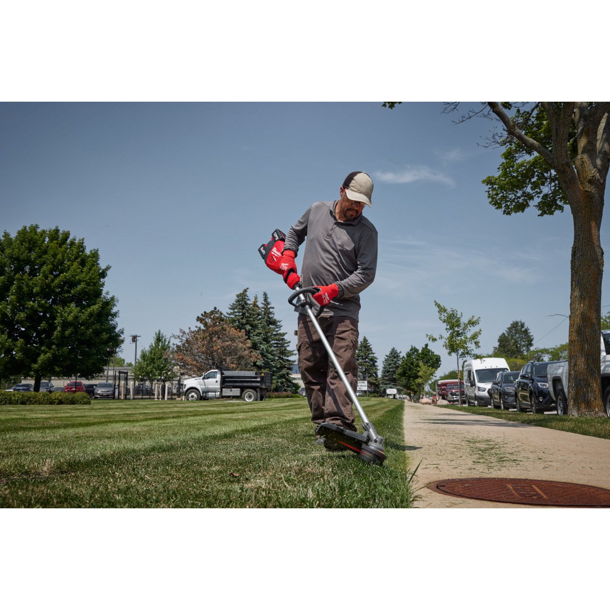 Milwaukee 3006-20 M18 FUEL™ 17” Dual Battery String Trimmer - in use