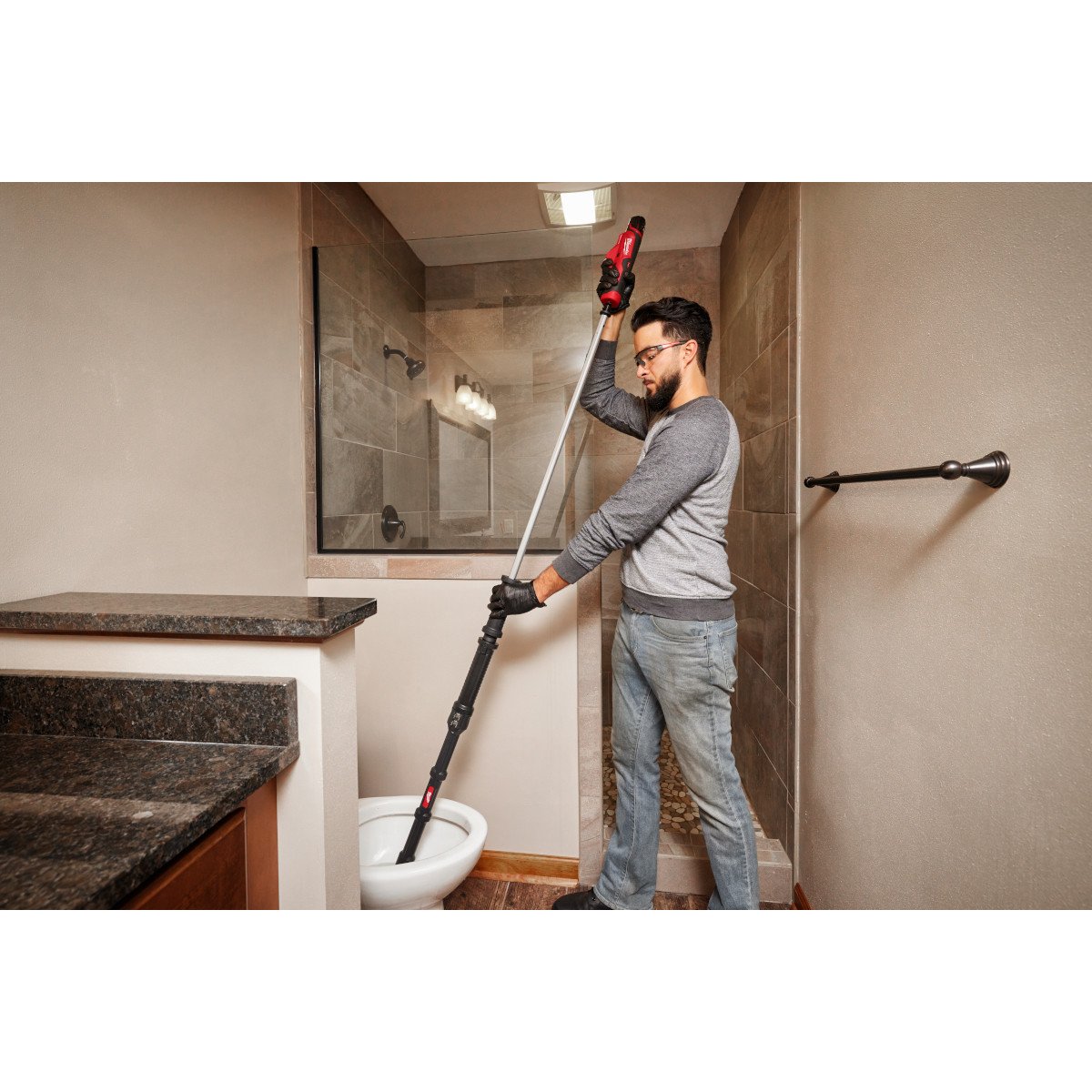 Milwaukee 3576-21 M12™ TRAPSNAKE™ 6' Toilet Auger - in use