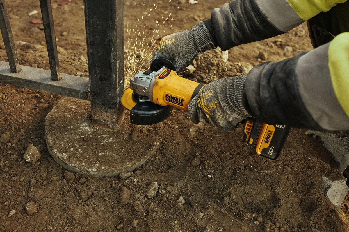 DEWALT DCG408B 20V MAX 4-1/2 in. Brushless Paddle-Switch Grinder (Tool Only) - in use