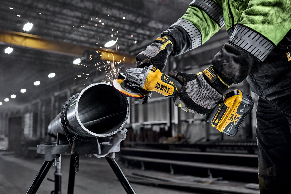 DEWALT DCG410WW1 20V MAX* XR® BRUSHLESS CORDLESS 4-1/2 IN. - 5 IN. ANGLE GRINDER KIT WITH XR POWERPACK™ - in use