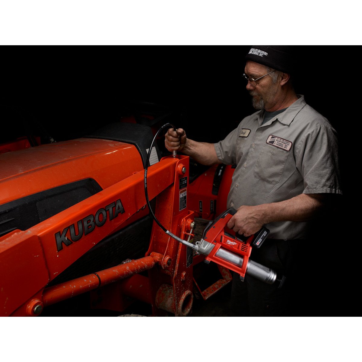 Milwaukee 2446-20 M12™ Cordless Grease Gun - in use