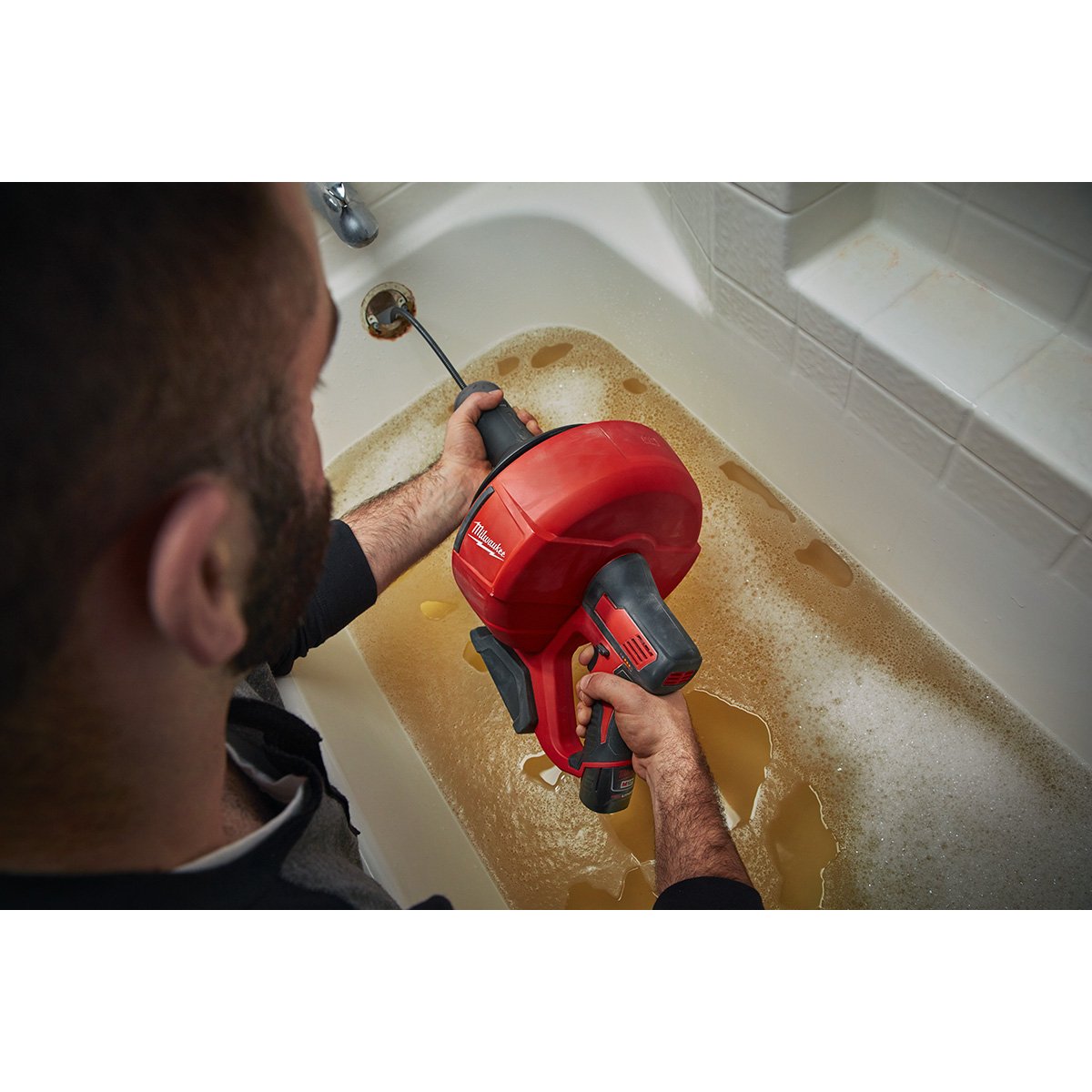 Milwaukee 2571-21 M12™ Drain Snake Kit - in use
