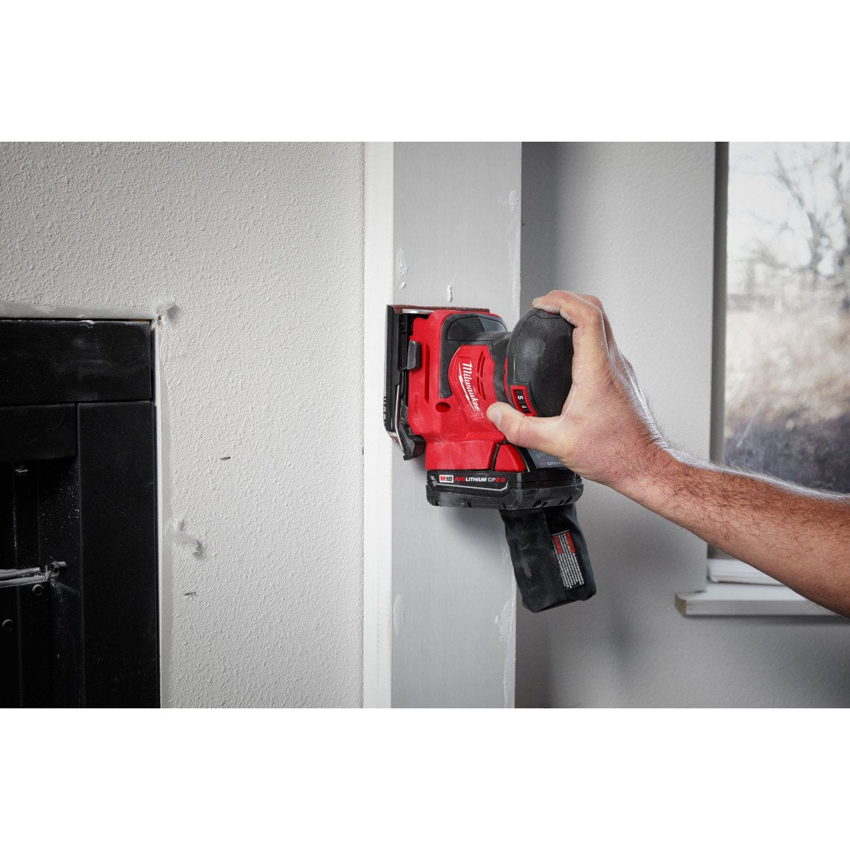 Milwaukee 2649-20 M18™ Orbital 1/4 Sheet Sander - in use