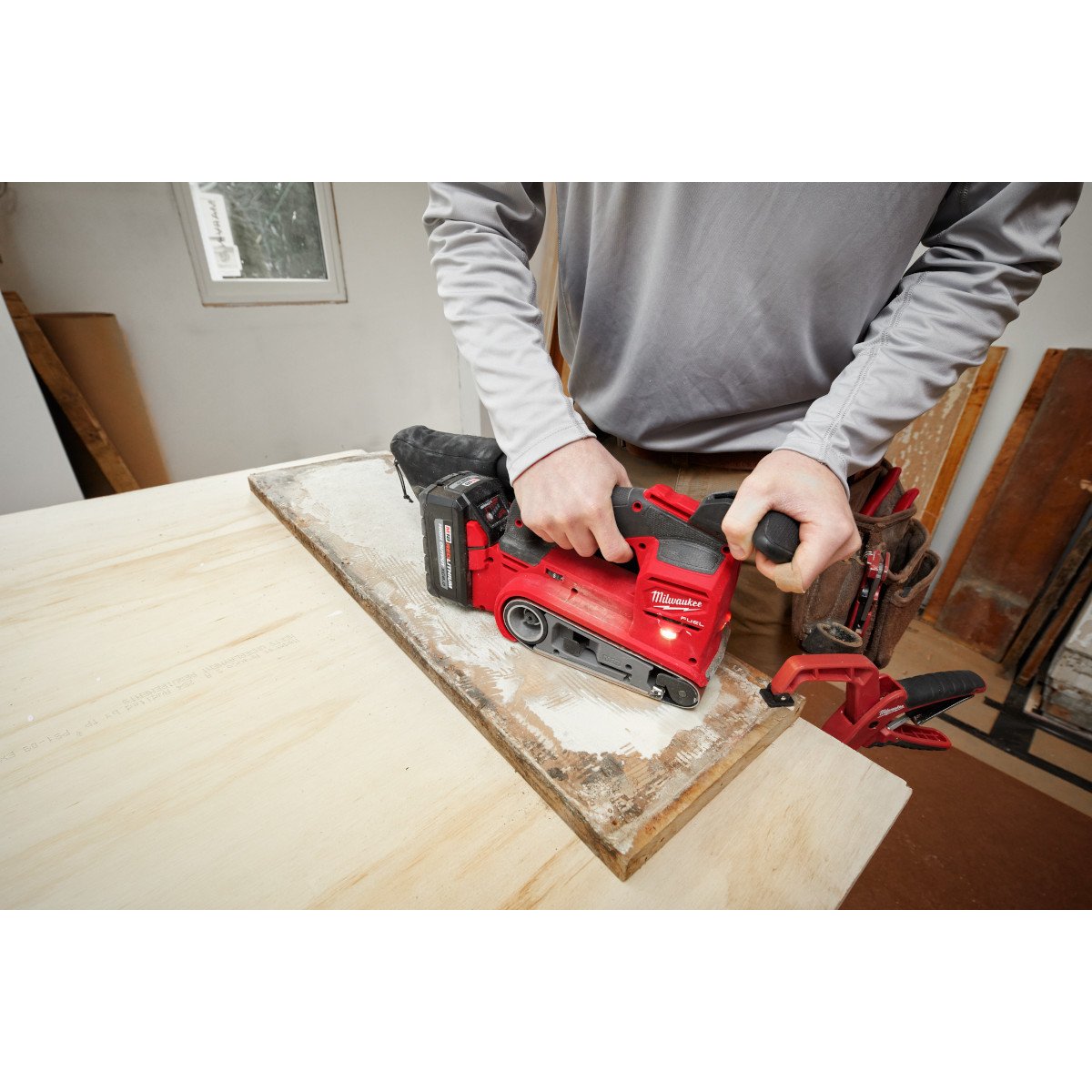 Milwaukee 2832-20 M18 FUEL™ 3"x18" Belt Sander - in use