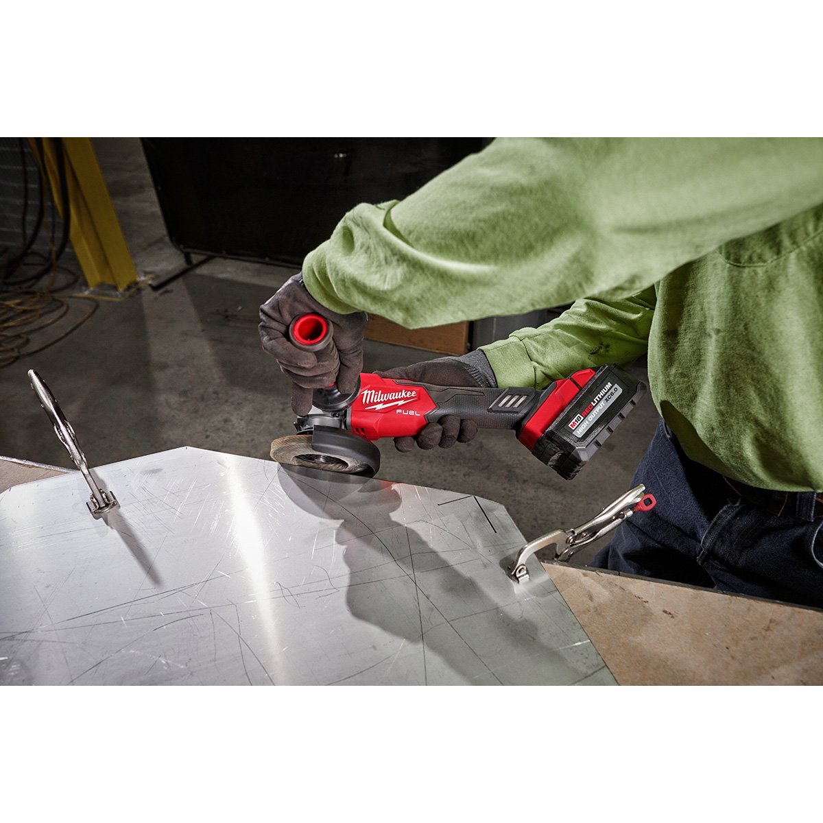 Milwaukee 2889-20 M18 FUEL™ 4-1/2" / 5" Variable Speed Braking Grinder, Slide Switch Lock-On - in use