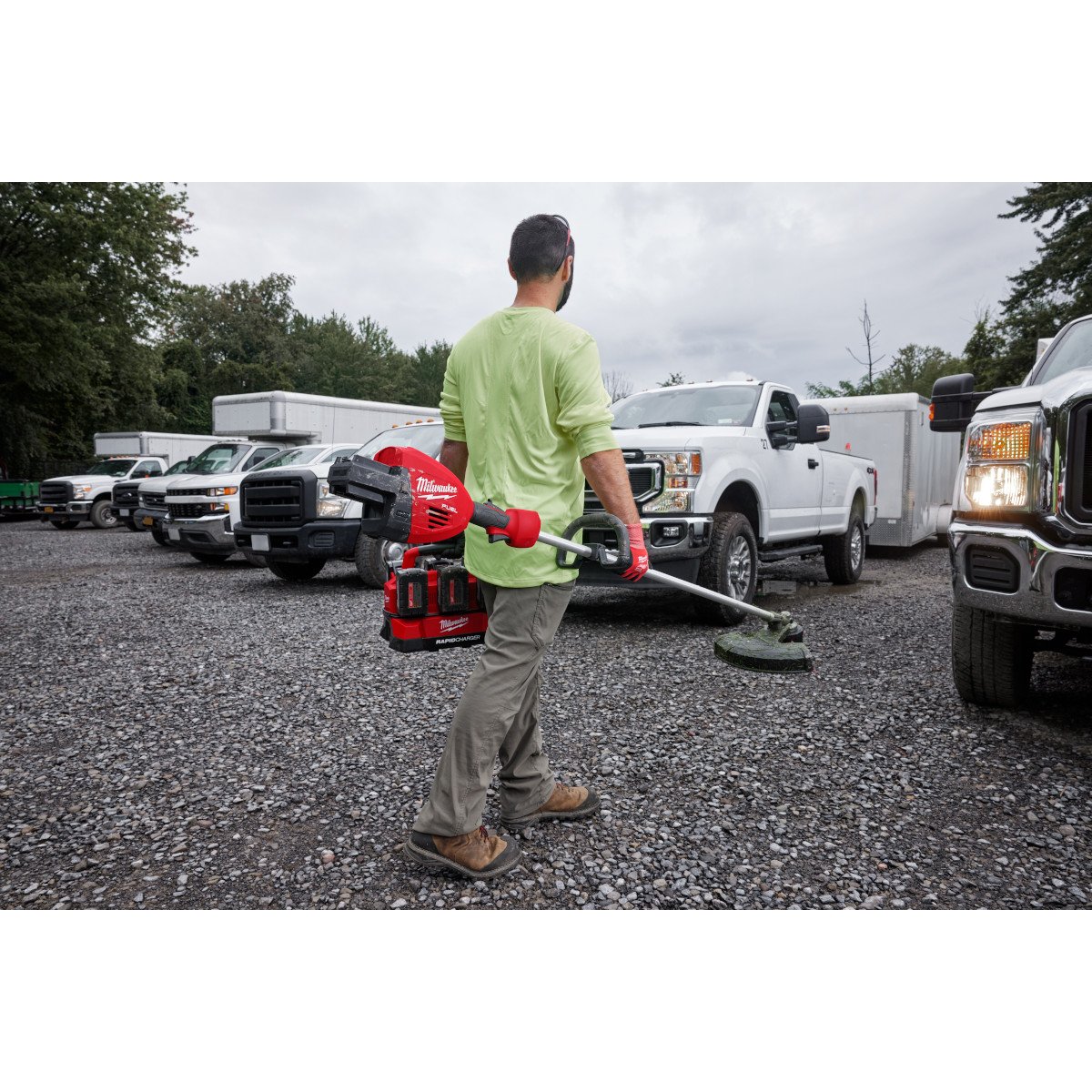 Milwaukee 3006-20 M18 FUEL™ 17” Dual Battery String Trimmer - in use