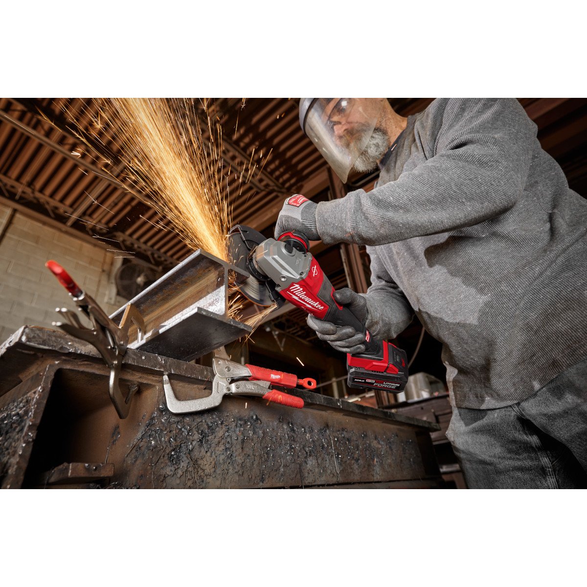 Milwaukee 3671-20 M18 FUEL™ 4-1/2"-6" Braking Grinder, Slide Switch - in use
