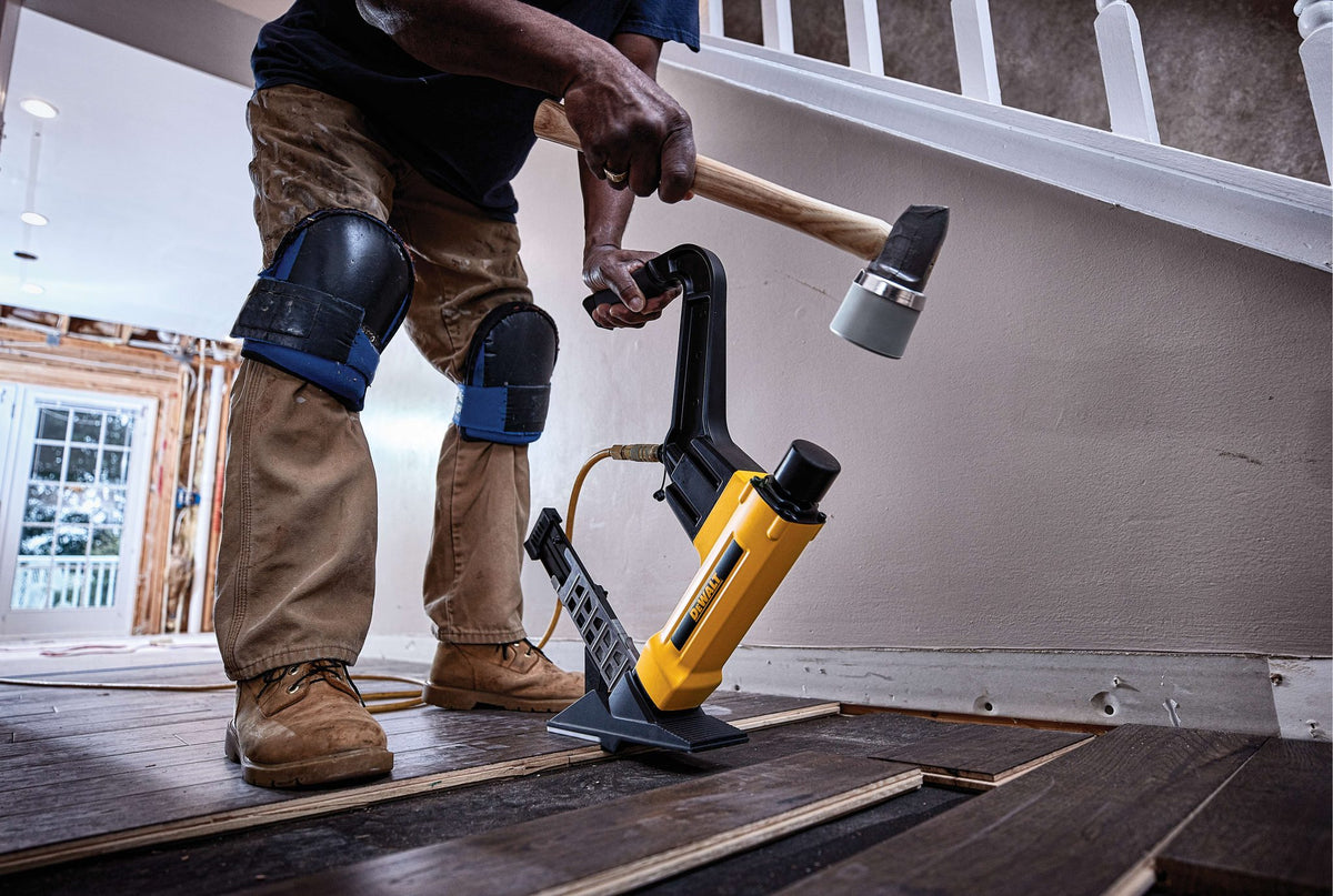 DEWALT DWFP12569 Flooring Stapler, 2-In-1 Tool - in use