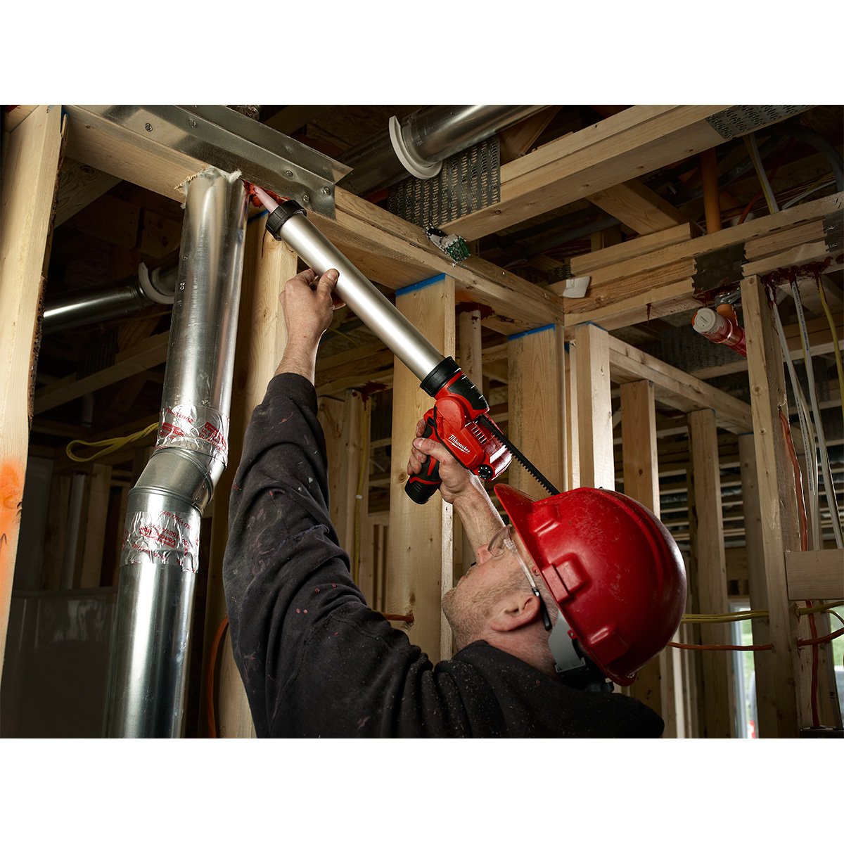 Milwaukee 2442-21 M12™ Sausage Caulk Gun Kit - in use