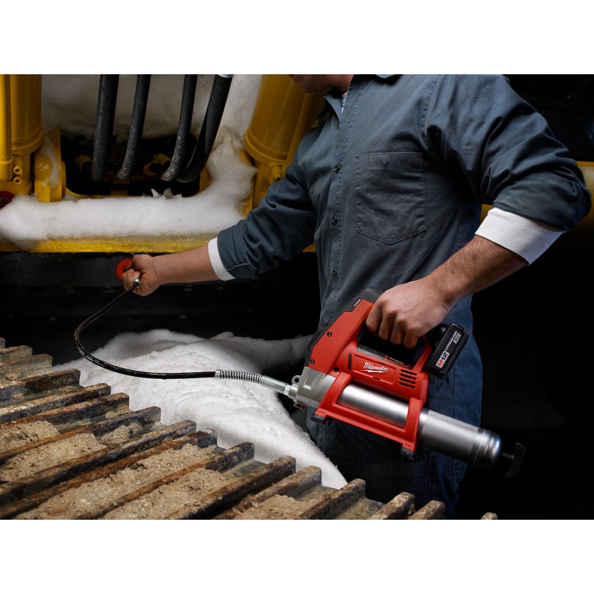 Milwaukee 2446-21XC M12™ Cordless Grease Gun Kit - in use