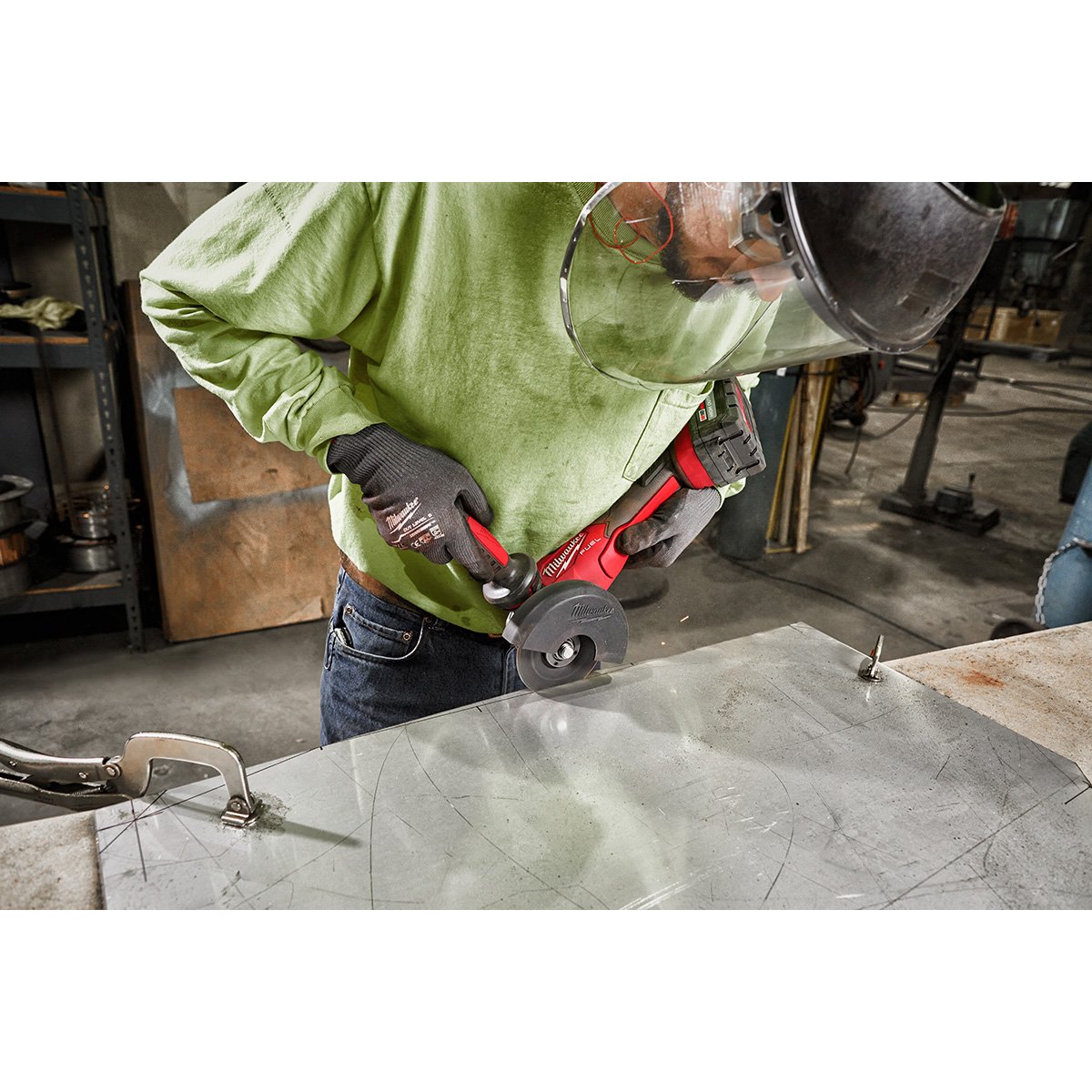 Milwaukee 2888-20 M18 FUEL™ 4-1/2" / 5" Variable Speed Braking Grinder, Paddle Switch No-Lock - in use