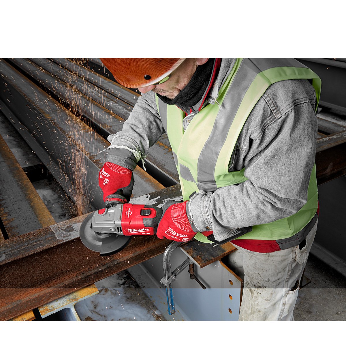 Milwaukee 2981-20 M18 FUEL™ 4-1/2 in.-6 in. Lock-On Braking Grinder with Slide Switch - in use