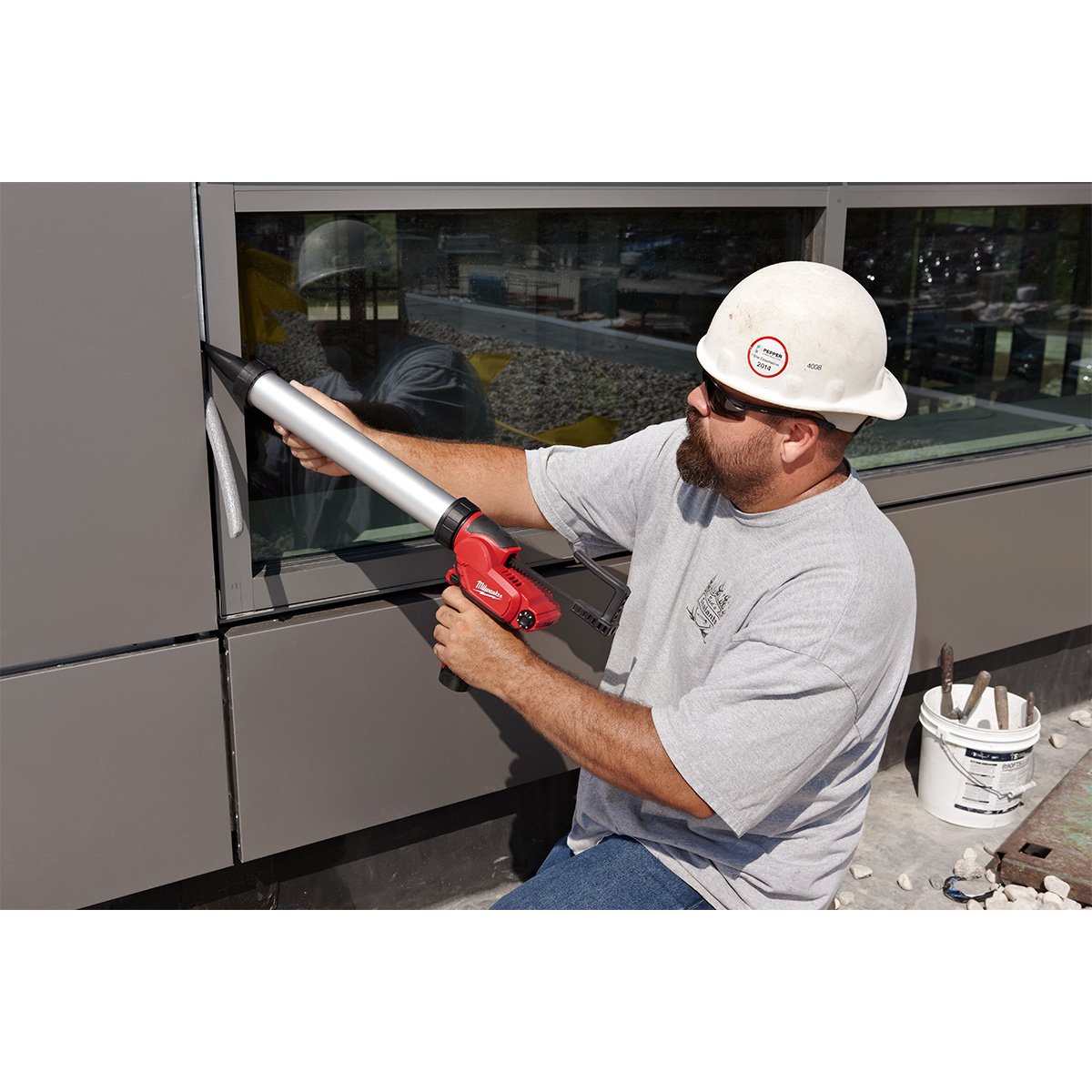 Milwaukee 2442-21 M12™ Sausage Caulk Gun Kit - in use