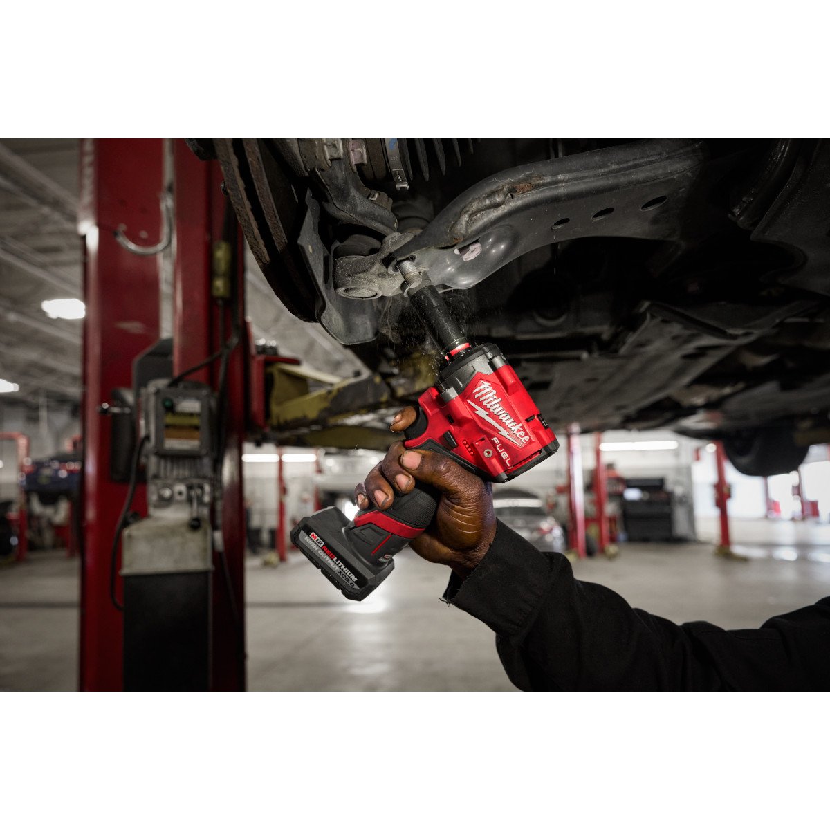 Milwaukee 2562-22 M12 FUEL™ Stubby 3/8" Impact Wrench Kit - in use