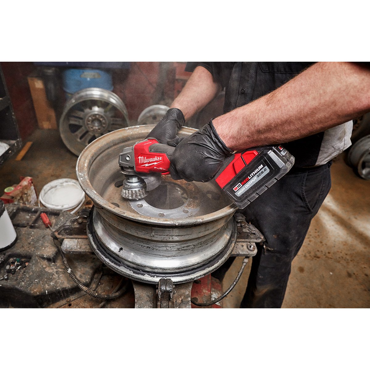 Milwaukee 2888-20 M18 FUEL™ 4-1/2" / 5" Variable Speed Braking Grinder, Paddle Switch No-Lock - in use