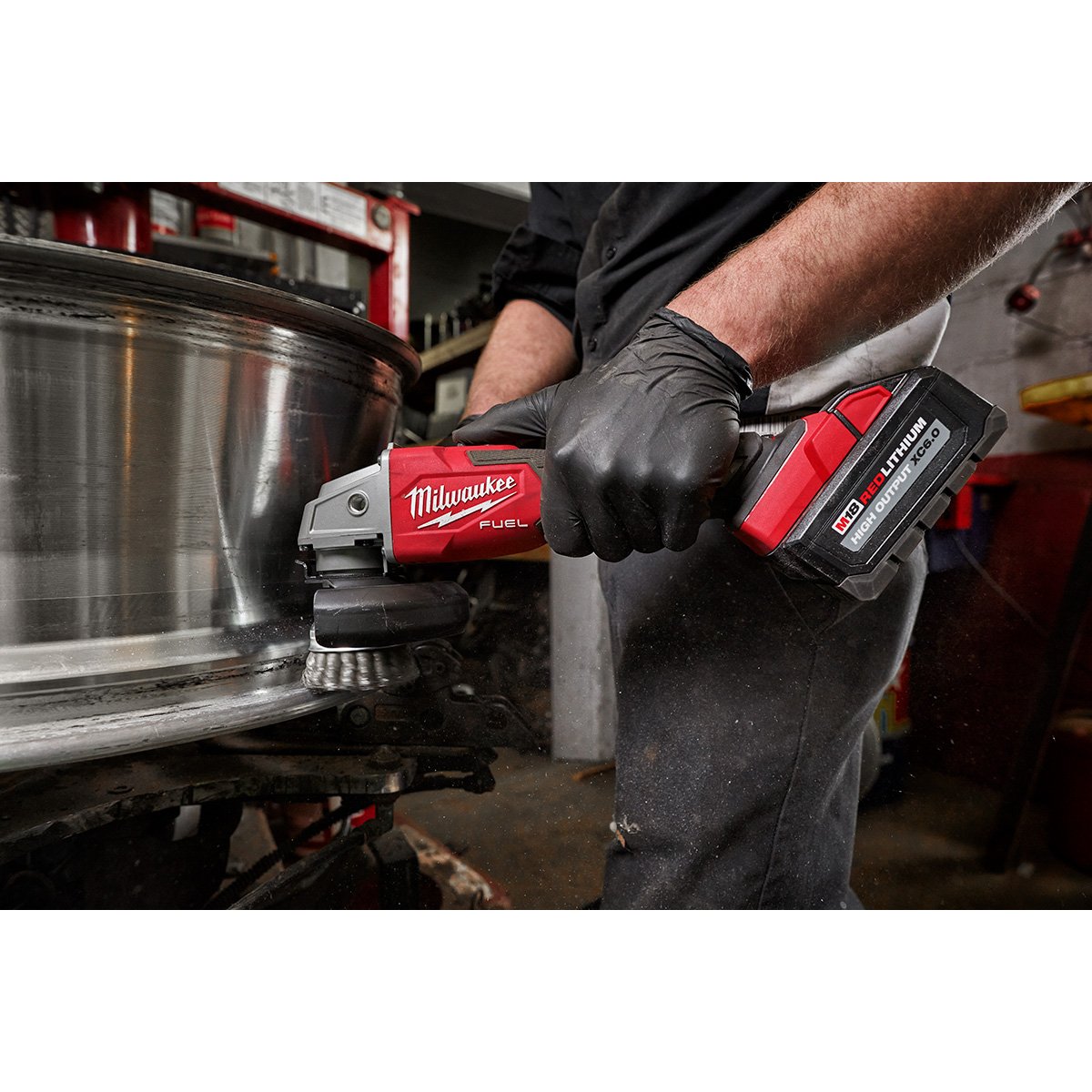 Milwaukee 2889-20 M18 FUEL™ 4-1/2" / 5" Variable Speed Braking Grinder, Slide Switch Lock-On - in use