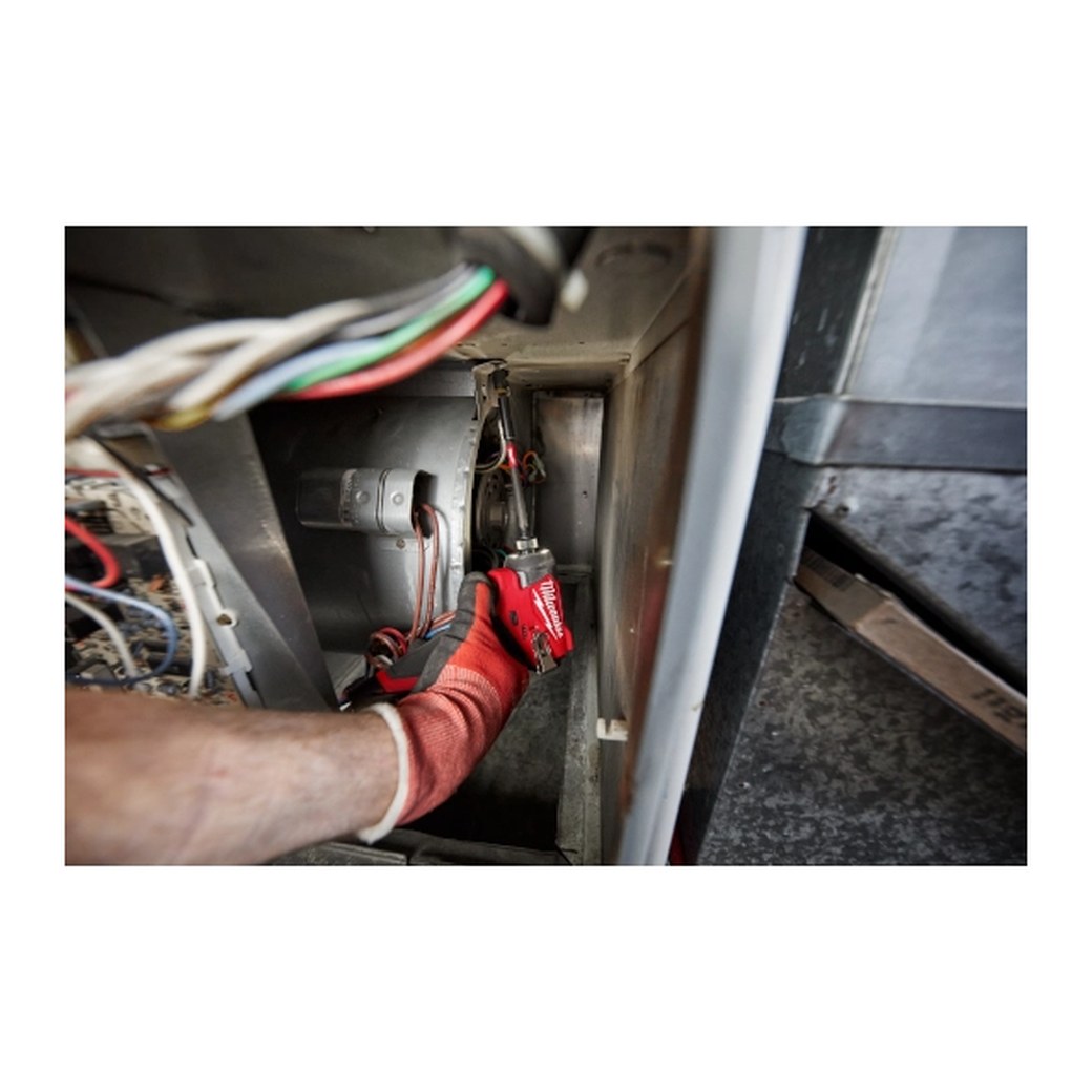 Milwaukee M12 FUEL 1/4" Hex Impact Driver - in use in a tight space