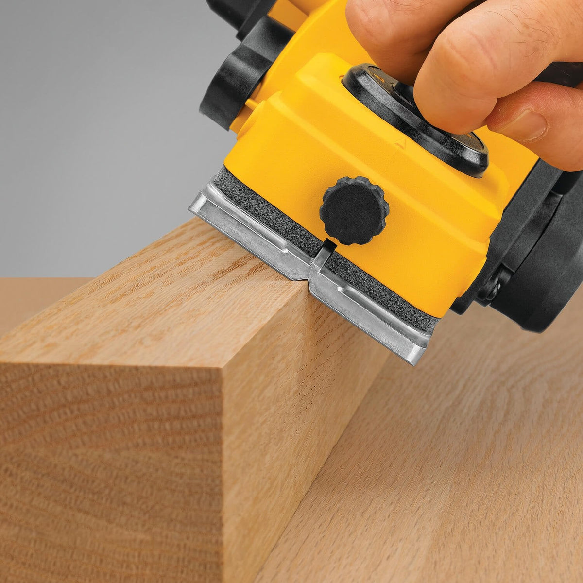 DEWALT hand planer smoothing a board