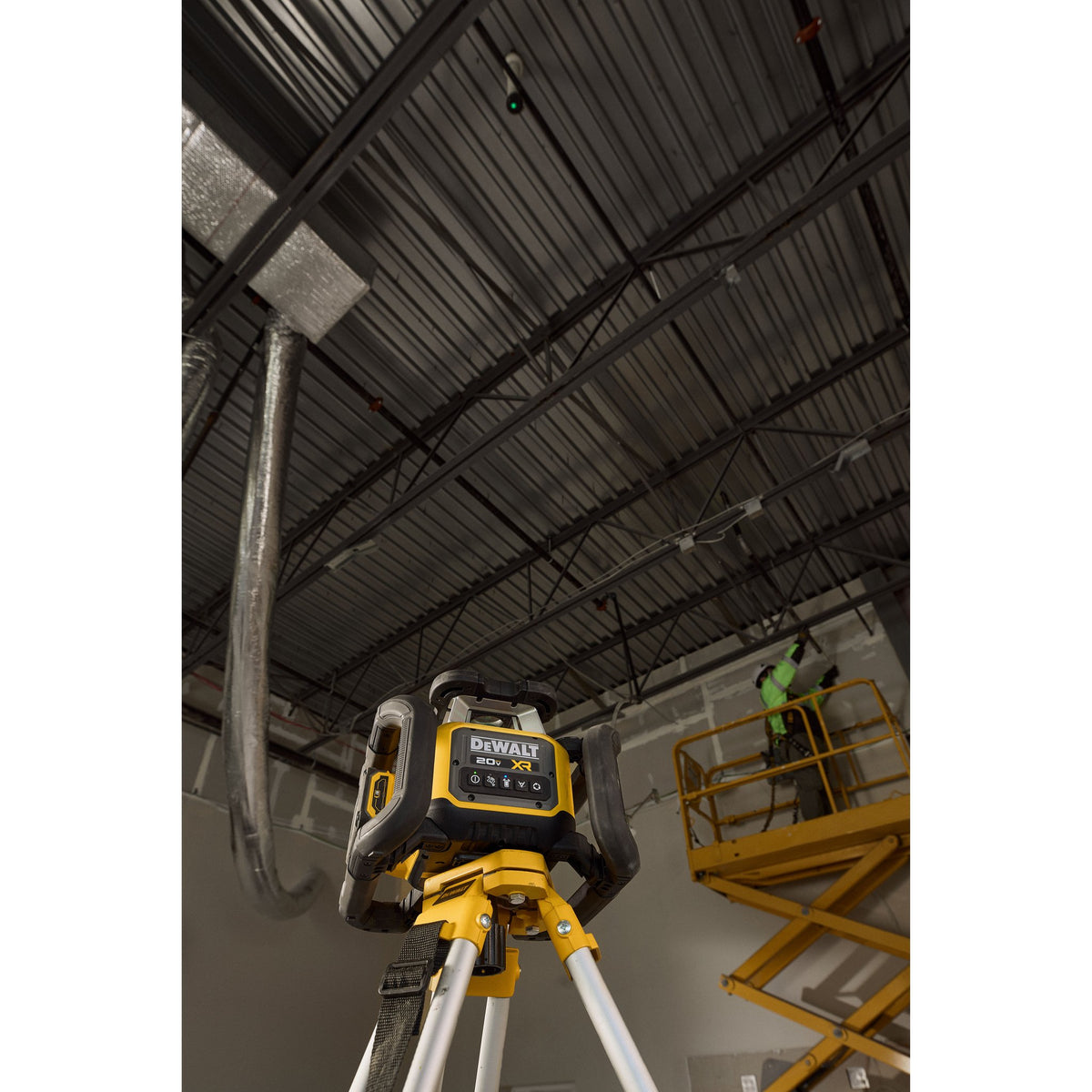 DEWALT DCLE35121GE1 20V MAX XR Green Rotary Laser Kit - in use on a tripod indoors