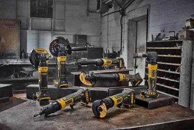 DEWALT cordless tools set up on a metalworking shop bench